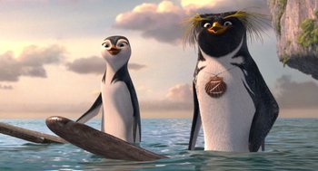 Movie still from “Surf's Up” (2007), directed by Chris Buck – A couple of penguins standing next to each other in the water; Close Up shot, Low angle