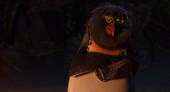 Movie still from “Surf's Up” (2007), directed by Chris Buck – A stuffed bird with a guitar in it's mouth; Close Up shot, High angle