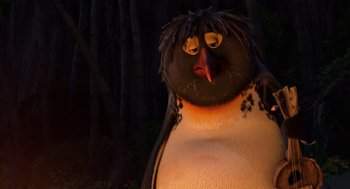 Movie still from “Surf's Up” (2007), directed by Chris Buck – A penguin with a black face; Close Up shot, Low angle