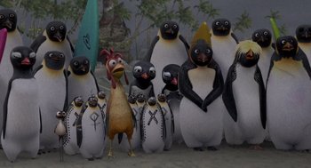 Movie still from “Surf's Up” (2007), directed by Chris Buck – A group of penguins standing next to each other; Wide shot, High angle