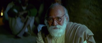 An older man with a beard and glasses