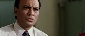 Movie still from “Like Stars on Earth” (2007), directed by Aamir Khan – A person wearing a shirt and a tie; Close Up shot, Low angle