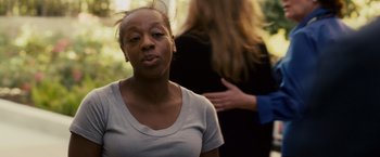 Movie still from “Takers” (2010), directed by John Luessenhop – A woman standing next to another woman in a forest; Close Up shot, Over the shoulder angle