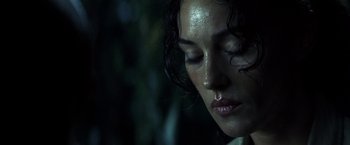 Movie still from “Tears of the Sun” (2003), directed by Antoine Fuqua – A woman's face with water on her face; Close Up shot, Low angle