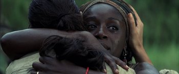 Movie still from “Tears of the Sun” (2003), directed by Antoine Fuqua – Two women hugging each other while one of them is crying; Close Up shot, Over the shoulder angle