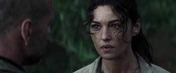 Movie still from “Tears of the Sun” (2003), directed by Antoine Fuqua – A person wearing a necklace; Close Up shot, Over the shoulder angle