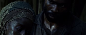 Movie still from “Tears of the Sun” (2003), directed by Antoine Fuqua – A person with a beard; Close Up shot, Over the shoulder angle