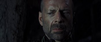 Movie still from “Tears of the Sun” (2003), directed by Antoine Fuqua – A person with a beard; Close Up shot, Low angle