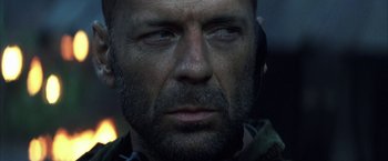 Movie still from “Tears of the Sun” (2003), directed by Antoine Fuqua – A person wearing headphones; Close Up shot, Low angle