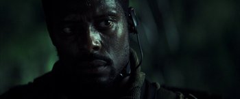 Movie still from “Tears of the Sun” (2003), directed by Antoine Fuqua – A person wearing a headset; Close Up shot, Low angle