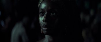 Movie still from “Tears of the Sun” (2003), directed by Antoine Fuqua – A person wearing a headscarf; Close Up shot, Low angle