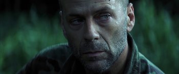 Movie still from “Tears of the Sun” (2003), directed by Antoine Fuqua – A person with a beard; Close Up shot, Low angle