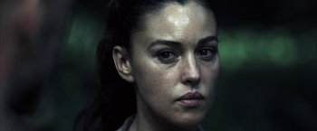 Movie still from “Tears of the Sun” (2003), directed by Antoine Fuqua – A woman's face in the dark; Close Up shot, Low angle