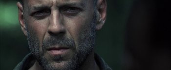 Movie still from “Tears of the Sun” (2003), directed by Antoine Fuqua – A man with a beard; Close Up shot, Low angle