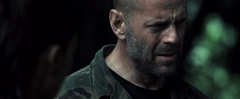 Movie still from “Tears of the Sun” (2003), directed by Antoine Fuqua – A person with a beard; Close Up shot, Over the shoulder angle