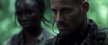 Movie still from “Tears of the Sun” (2003), directed by Antoine Fuqua – A person wearing a headset; Close Up shot, Low angle