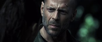 Movie still from “Tears of the Sun” (2003), directed by Antoine Fuqua – A person with a beard; Close Up shot, Over the shoulder angle