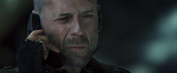 Movie still from “Tears of the Sun” (2003), directed by Antoine Fuqua – A person wearing a headset; Close Up shot, Low angle