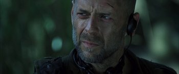 Movie still from “Tears of the Sun” (2003), directed by Antoine Fuqua – A person with a beard; Close Up shot, Low angle