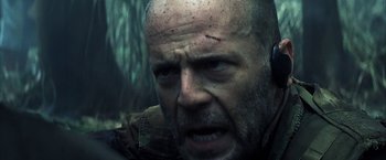 Movie still from “Tears of the Sun” (2003), directed by Antoine Fuqua – A person with a head wound; Close Up shot, Low angle