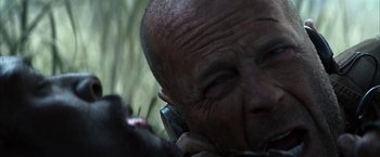 An old man is talking on a cell phone