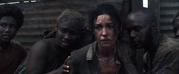 Movie still from “Tears of the Sun” (2003), directed by Antoine Fuqua – Two women are standing next to each other; Close Up shot, High angle