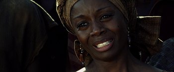 Movie still from “Tears of the Sun” (2003), directed by Antoine Fuqua – A person wearing a headscarf; Close Up shot, Low angle