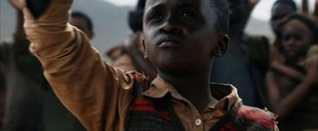 Movie still from “Tears of the Sun” (2003), directed by Antoine Fuqua – A person with his eyes wide open; Close Up shot, Low angle