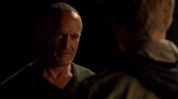 Movie still from “Breaking Bad” (2008), created by Vince Gilligan – A person talking to another person; Close Up shot, Over the shoulder angle