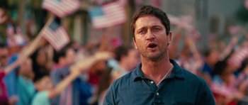 Movie still from “The Bounty Hunter” (2010), directed by Andy Tennant – A person wearing a blue shirt; Close Up shot, Low angle