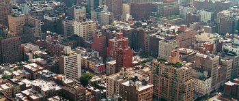 Movie still from “The Bounty Hunter” (2010), directed by Andy Tennant – An aerial view of a large city with many buildings; Extreme Wide shot, Overhead angle