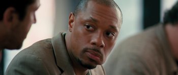 Movie still from “The Bounty Hunter” (2010), directed by Andy Tennant – A person wearing a suit and tie; Close Up shot, Low angle