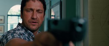 Movie still from “The Bounty Hunter” (2010), directed by Andy Tennant – A person taking a picture with a cell phone; Close Up shot, Over the shoulder angle