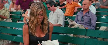 Movie still from “The Bounty Hunter” (2010), directed by Andy Tennant – A woman sitting on a bench with a bag of food; Close Up shot, Over the shoulder angle