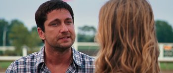 Movie still from “The Bounty Hunter” (2010), directed by Andy Tennant – A person talking to another person; Close Up shot, Over the shoulder angle