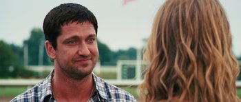 Movie still from “The Bounty Hunter” (2010), directed by Andy Tennant – A person talking to another person; Close Up shot, Over the shoulder angle