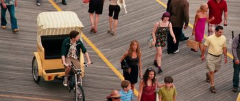 Movie still from “The Bounty Hunter” (2010), directed by Andy Tennant – A group of people walking down a sidewalk; Wide shot, High angle