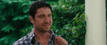 Movie still from “The Bounty Hunter” (2010), directed by Andy Tennant – A person with a beard; Close Up shot, Over the shoulder angle