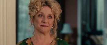 Movie still from “The Bounty Hunter” (2010), directed by Andy Tennant – A person with curly blonde hair; Close Up shot, Over the shoulder angle