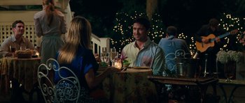 Movie still from “The Bounty Hunter” (2010), directed by Andy Tennant – A man and a woman sitting at a dinner table; Medium shot, Over the shoulder angle
