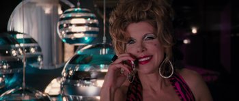 Movie still from “The Bounty Hunter” (2010), directed by Andy Tennant – A woman talking on a cell phone while smiling; Close Up shot, Low angle