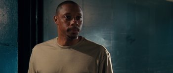 Movie still from “The Bounty Hunter” (2010), directed by Andy Tennant – A person wearing a tan shirt; Close Up shot, Low angle