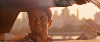 Movie still from “The Bounty Hunter” (2010), directed by Andy Tennant – A man looking out of a car window; Close Up shot, Over the shoulder angle