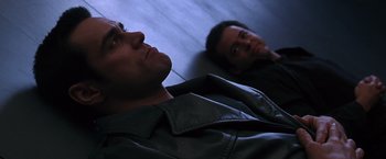 Movie still from “The Cable Guy” (1996), directed by Ben Stiller – Two men are laying on the floor looking up; Close Up shot, Low angle