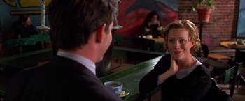 Movie still from “The Cable Guy” (1996), directed by Ben Stiller – A man and a woman are sitting at a table; Medium shot, Over the shoulder angle