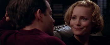 Movie still from “The Cable Guy” (1996), directed by Ben Stiller – A man and a woman sitting on a leather couch; Close Up shot, Over the shoulder angle