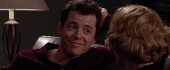 Movie still from “The Cable Guy” (1996), directed by Ben Stiller – A person sitting down with his hand on his head; Close Up shot, Over the shoulder angle