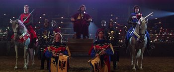 Movie still from “The Cable Guy” (1996), directed by Ben Stiller – A group of people dressed in medieval costumes; Wide shot, High angle