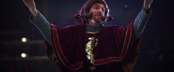 Movie still from “The Cable Guy” (1996), directed by Ben Stiller – A man dressed as a medieval knight in a costume; Medium shot, Low angle