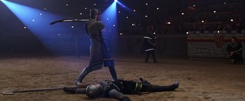 Movie still from “The Cable Guy” (1996), directed by Ben Stiller – A knight in a suit of armor standing next to a knight; Wide shot, High angle